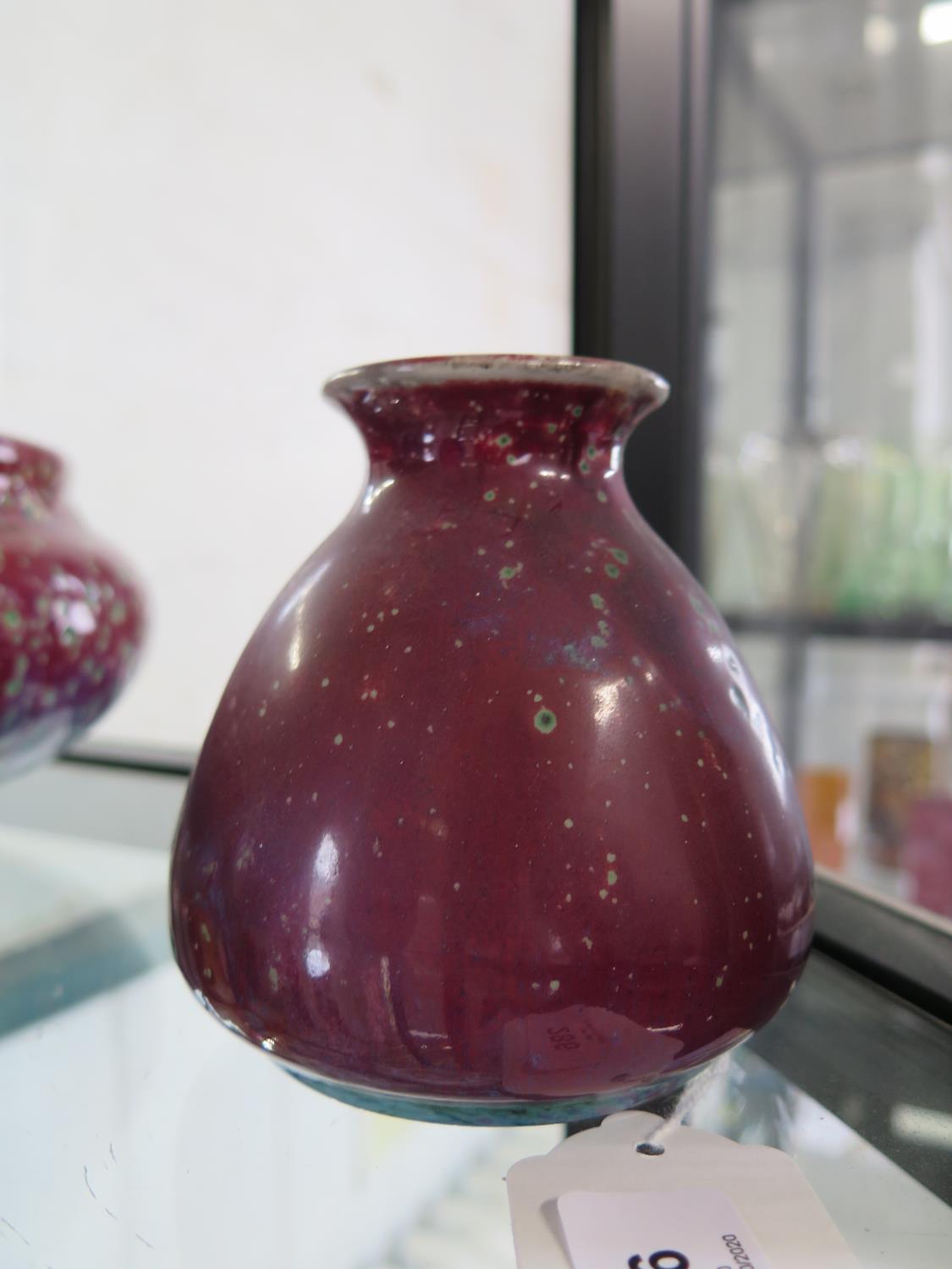 A Ruskin Pottery tapering vase, with sang de beouf and blue speckled glaze, impressed mark and dated