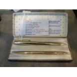 A Parker 65 12ct rolled gold Custom Insignia fountain pen and pencil set, in a Parker case