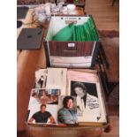 A signed and dedicated photograph of Tom Jones, other related loose photographs and negatives of Tom