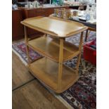 An Ercol elm and beech three tier tea trolley, on castors, 71 x 46 cm, 77 cm high