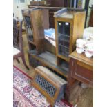 An oak and lead glazed desk top bookcase, the two glazed flaps over a centre flap flanked by a