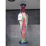 A Moorcroft Pottery slender Trinity pattern vase, signed by Philip Gibson and numbered 266, 31.5