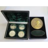 A cased set of four 5 Yuan silver coins depicting the Chinese Terracotta Army (1984), and a Royal