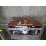 A tortoiseshell table cigar box decorated in silver pique 14cm x 9cm x 5cm