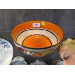 A Clarice Cliff Fantasque bowl, painted with stylised fruit, 19.5 cm diameter