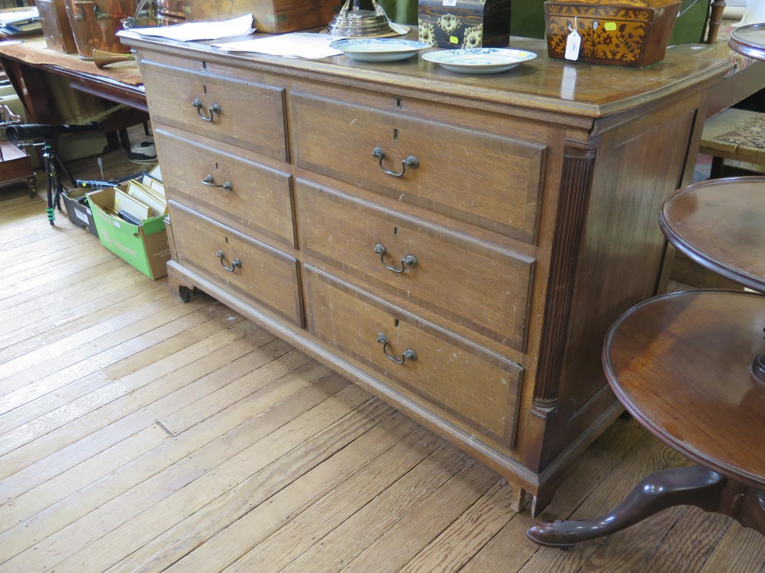 A George III oak and mahogany crossbanded Lancashire mule chest, the hinged top over four short