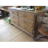 A George III oak and mahogany crossbanded Lancashire mule chest, the hinged top over four short