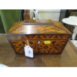 A Regency rosewood and amboyna inlaid tea caddy, of sarcophagus form, enclosing two lidded