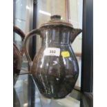 A Trevor Corser lidded jug, with dark green glaze, Leach Pottery and personal stamps, 23 cm high