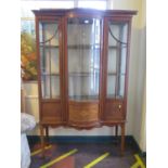 An Edwardian inlaid mahogany bowfront display cabinet, the raised back over a bowed centre flanked