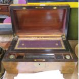 A mid Victorian burr walnut and brass bound writing box, with fitted interior (one slope missing),