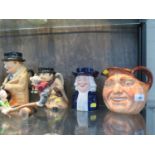 A Royal Doulton Winston Churchill toby jug, 22 cm high, a John Barleycorn jug, a Copeland Spode Toby