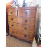 A Victorian mahogany bowfront chest of drawers, the crossbanded top over two short and three long
