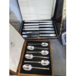 A cased set of six seal top coffee spoons, together with a cased set of silver handled tea knives