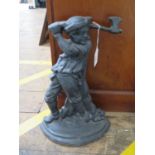 A cast iron door stop in the form of a woodsman, 37 cm high