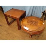 A 1970s teak nest of tables, and a low carved teak circular coffee table in the Chinese style (2)