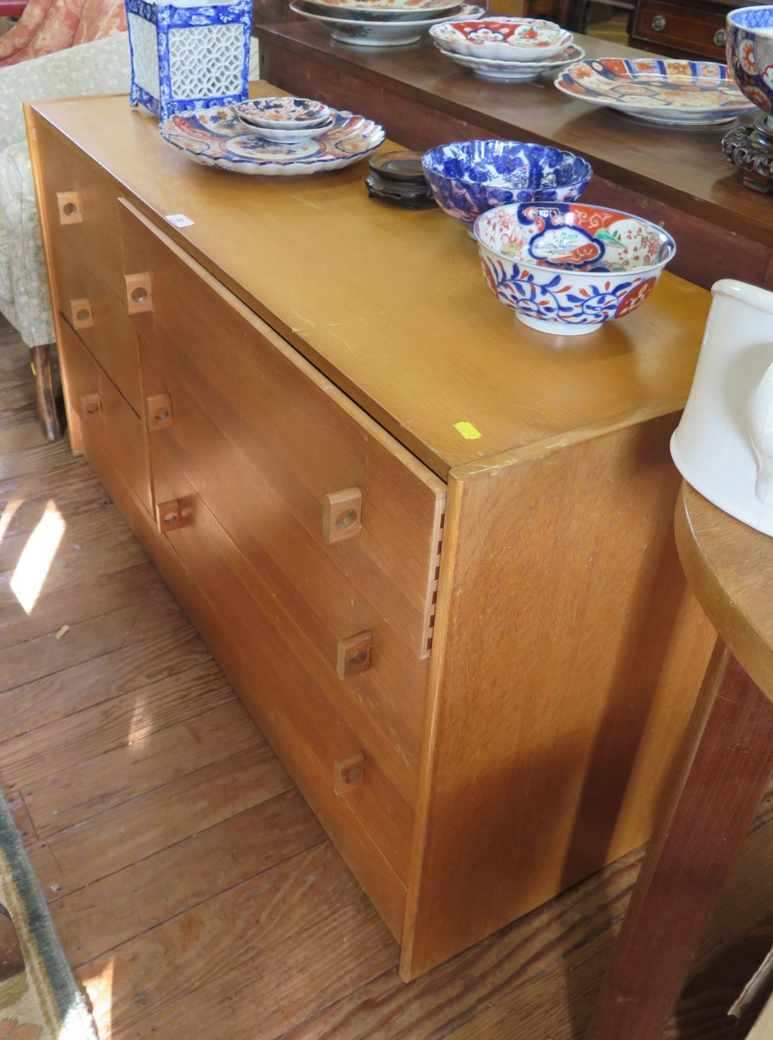 A light oak Stag Furniture chest of drawers, the three short drawers beside three long drawers on