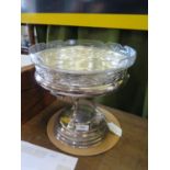 A silver plated table centre piece with glass dish on hoofed supports and circular base