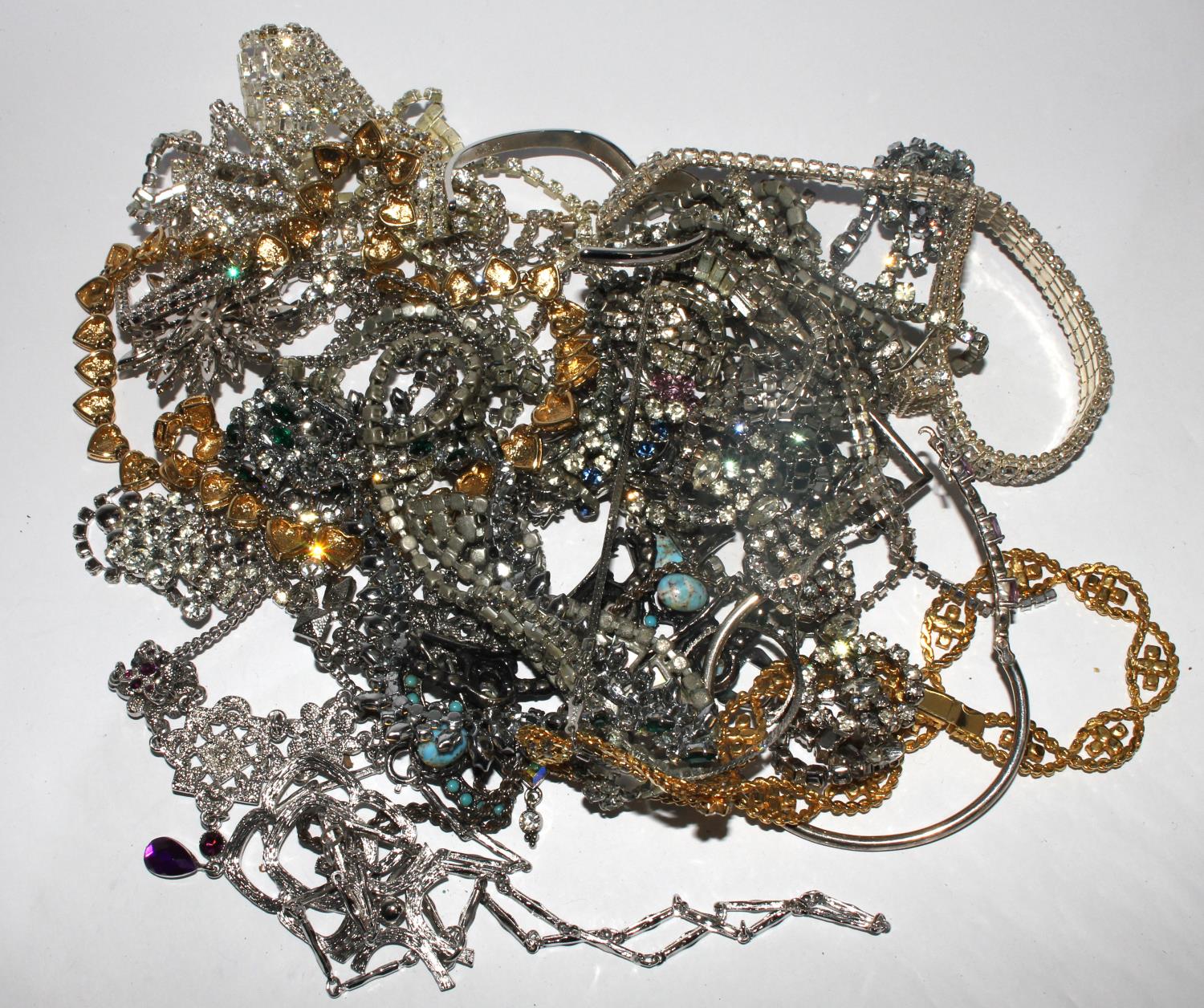 A bag of bright costume jewellery