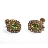 A pair of peridot and seed pearl earrings