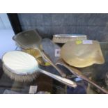 A silver plated hand mirror and brush together with a pair of silver and enamel brushes,