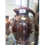 A Trevor Corser jug, with brown and black glaze, Leach Pottery and personal stamps, 22 cm high