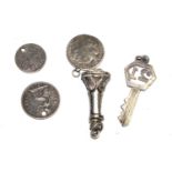 Two silver charms and three silver coins