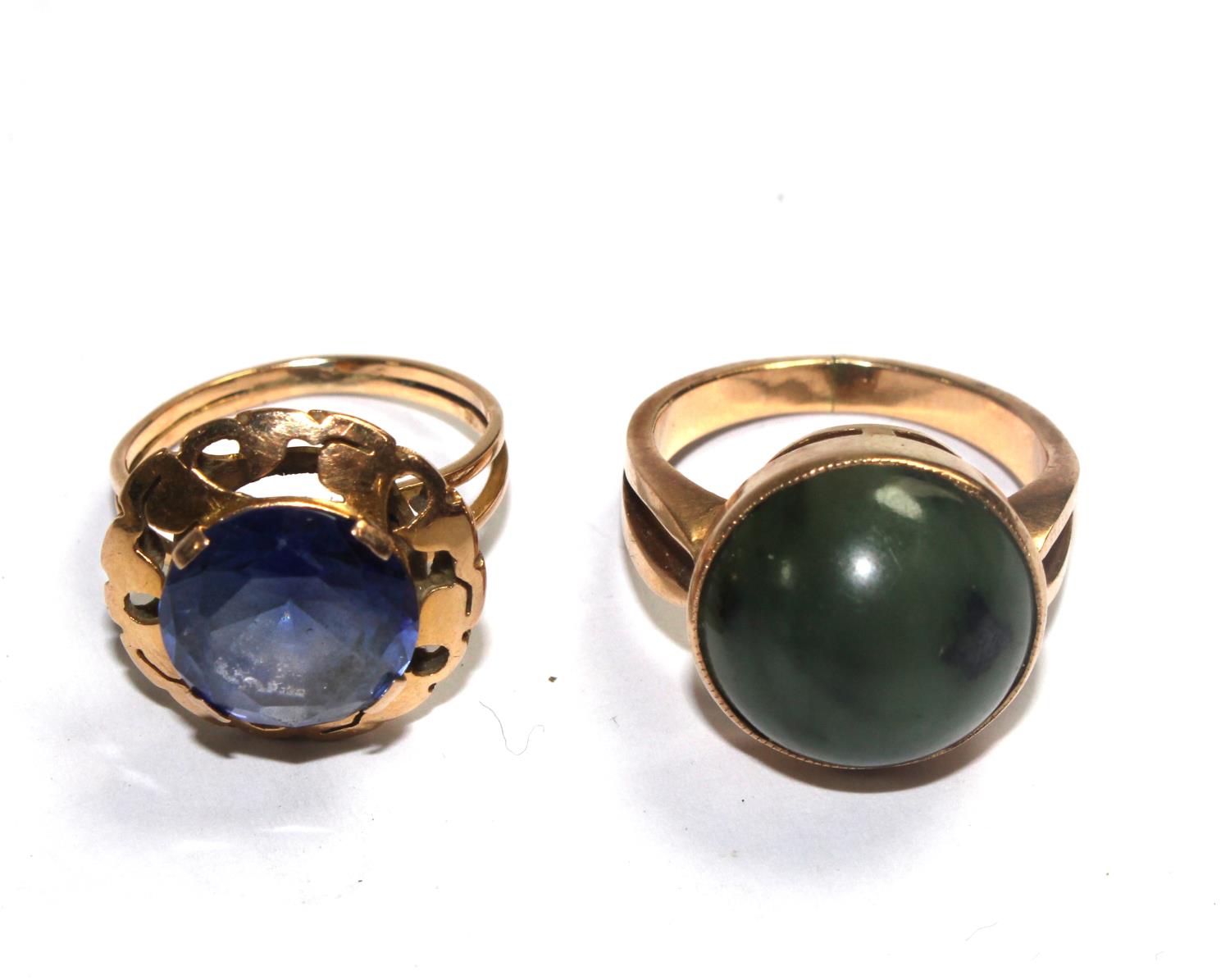 Two gem set rings in gold colour metal