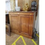 A Victorian mahogany side cabinet, the raised back over two panelled doors on a plinth base, 104