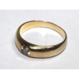 A Gentleman's 9 carat gold ring set with a single diamond