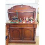 A Victorian mahogany chiffonier, the raised back with barley-twist supports over a shaped top and