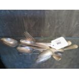 A set of six silver tea spoons, a pair of sugar tongs, and a fork and spoon set with engraved
