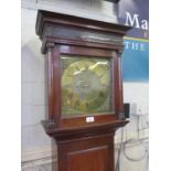 A George III oak longcase clock, the matted brass dial with mask scroll spandrels, the chapter