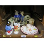 A Lladro figure of a cross-legged ballerina, another of a child cleaning her dog, and a group figure