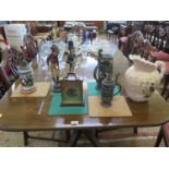 Three steins, two character figure candlesticks, a ceramic jug and a mantel clock (7)