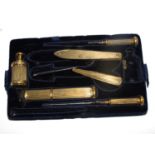 A gilded desk necessaire, including paper weight, penknife, pencil lead container, scissors, etc,