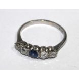 A five stone diamond and sapphire ring