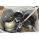 Three brass coal helmets, fire irons, bellows, warming pan and brass tray