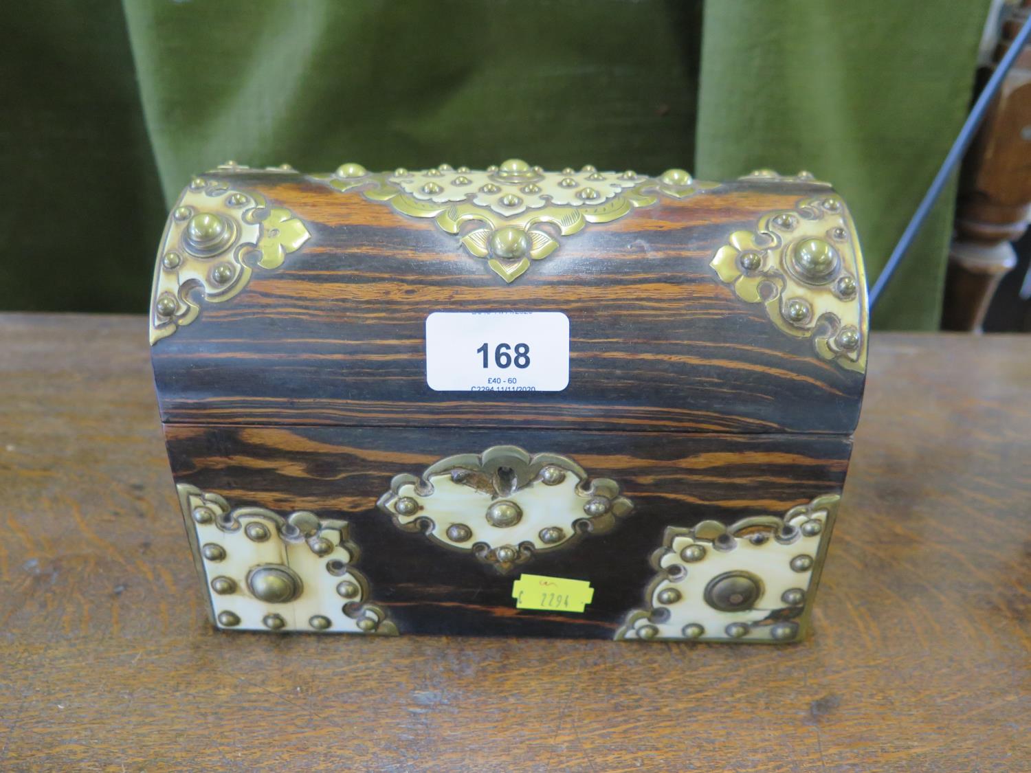 A Victorian coromandel and brass mounted stationery box, the domed lid enclosing a fitted