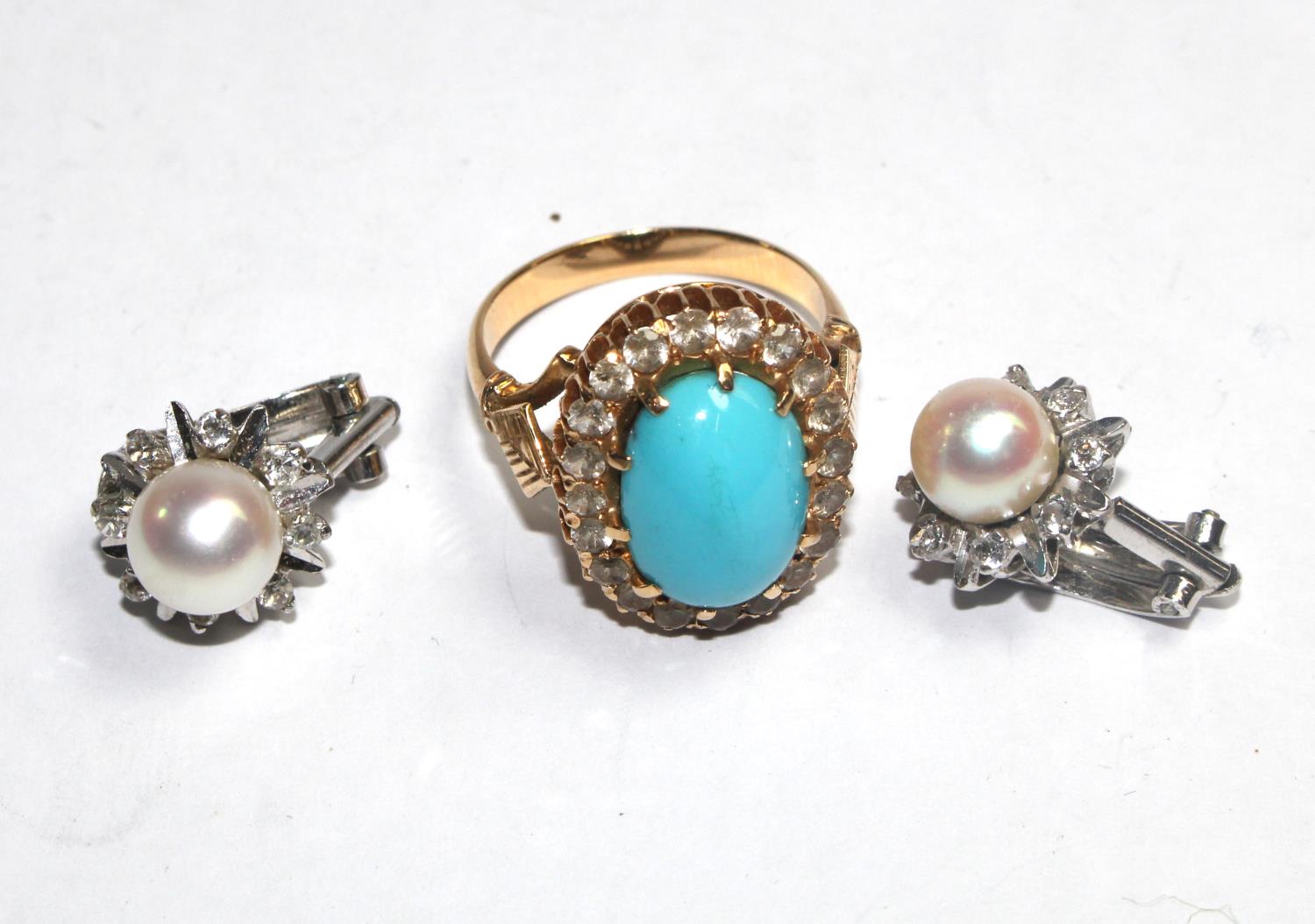 A pair of 18 carat white gold pearl earrings and a turquoise and gold coloured metal ring