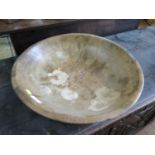 An 18th century fruitwood circular bowl, 46 cm diameter (with crack)