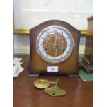 A 1950s oak cased mantel clock, the eight day movement striking on a gong, 19.5 cm high