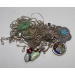 A bag of seven silver necklaces, brooches and one silver bracelet