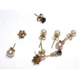 A small collection of pearl earrings