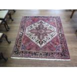 An Afghan rug, the brown stylised foliate medallion on an ivory field and red spandrels, in a