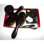 A pair of ladies tortoiseshell hair brushes together with a tortoiseshell lidded jar, a