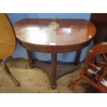 A Regency style side table, the kidney shape top on turned supports and platform base with pad feet,