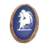 A Wedgwood blue jasper plaque set in 9 carat gold frame