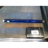 A blue glass cylindrical ruler, 25 cm long, a card case and a wooden measuring ruler (3)