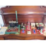 A painted tin plate stationary steam engine 36cm, three small engines, Mamod accessories and three